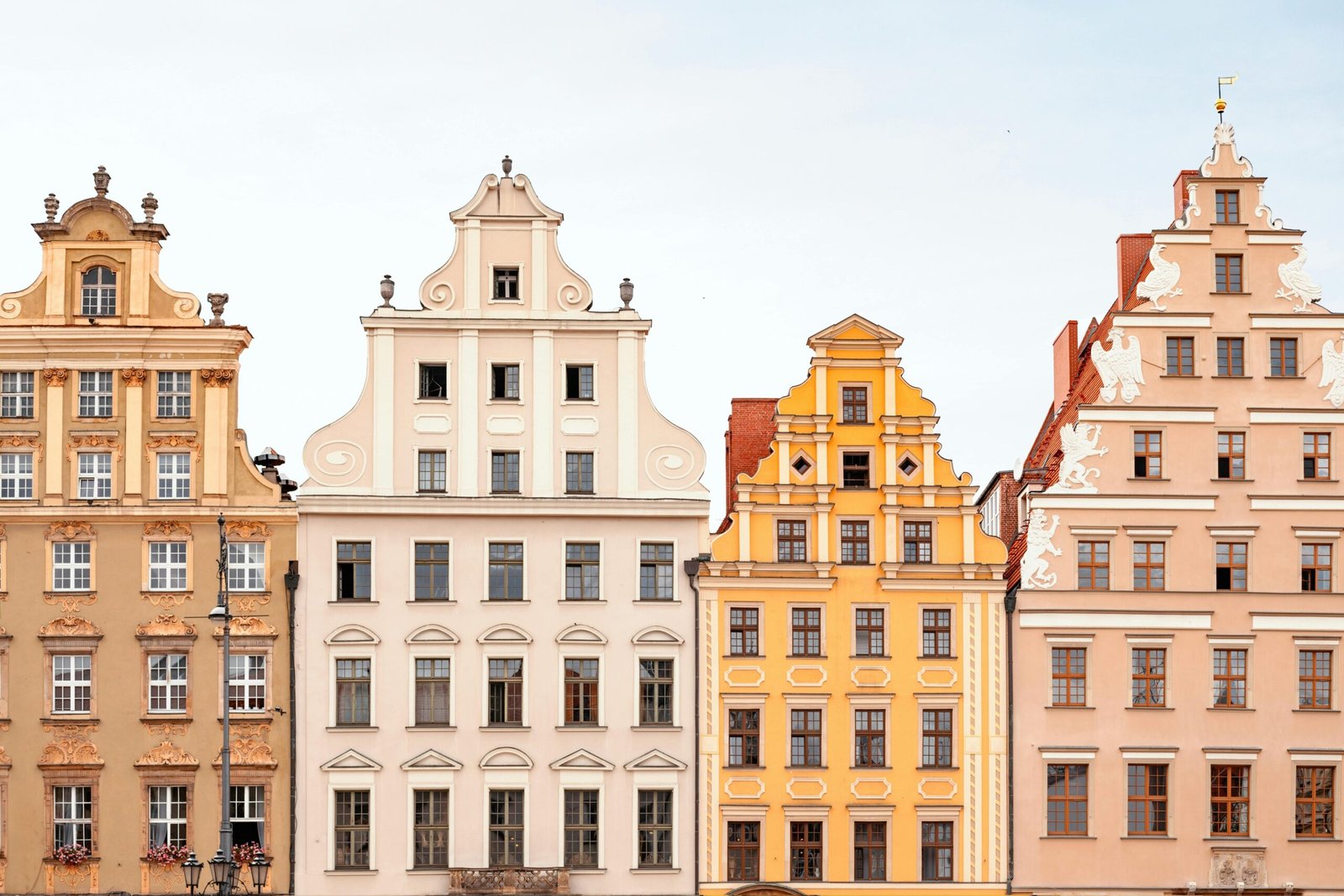 A beautiful photo of colorful houses in the Wroclaw city center, a prime example of the stunning scenery you can enjoy even when living on a Wroclaw on a Budget.