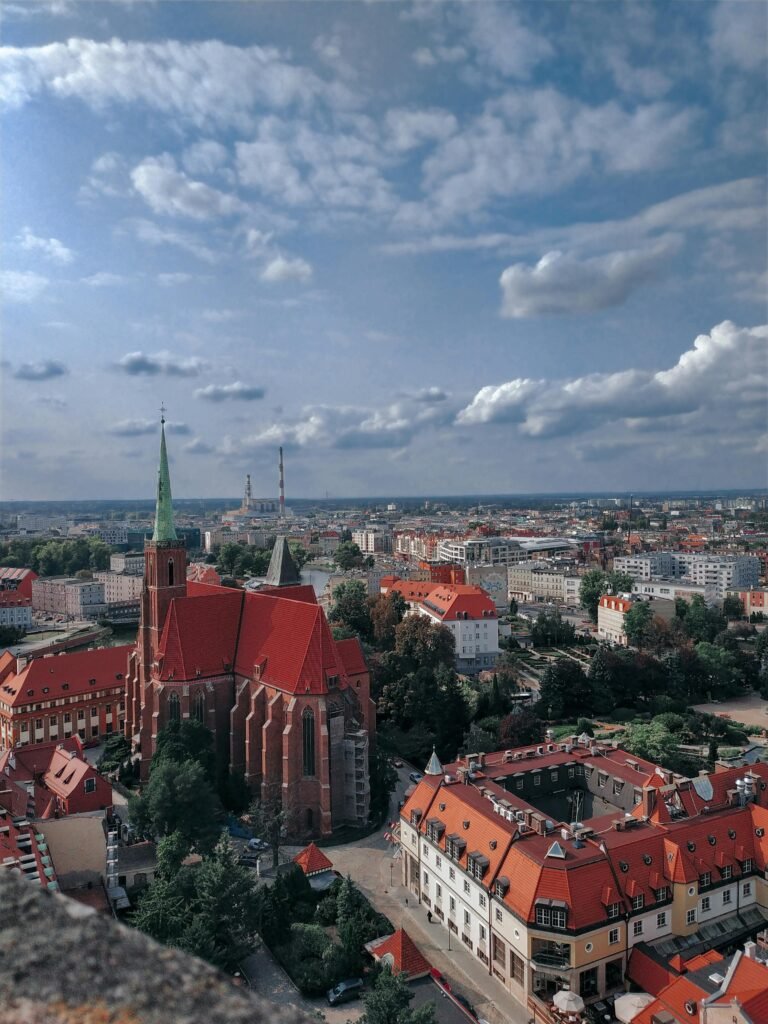 A panoramic view of Wroclaw city, showcasing its beautiful architecture and a vibrant urban landscape, proving you can still enjoy the sights and sounds of the city on a Wroclaw on a Budget.